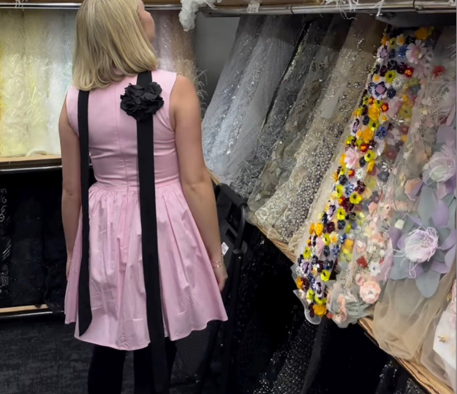woman walking in fabric store