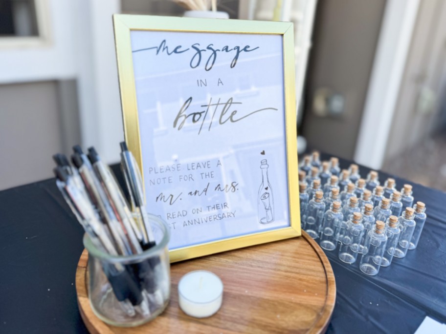 gold frame next to jar of pens 