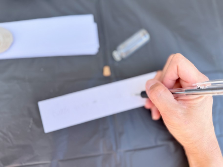 hand writing on slip of paper