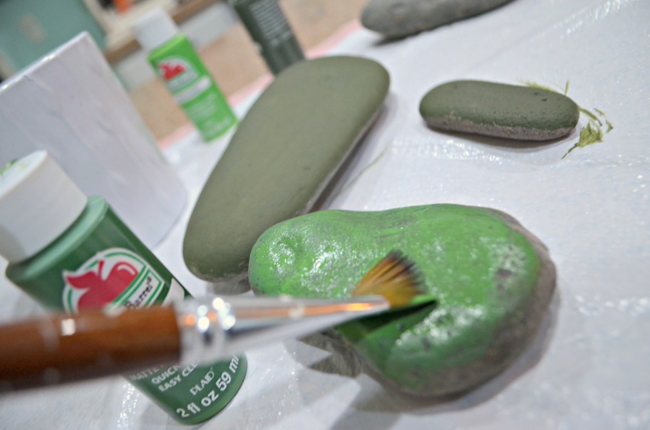 rock being painted green