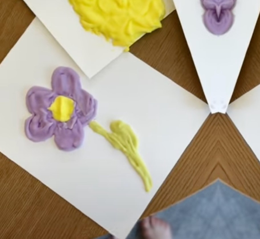 flower of purple puffy paint made out of shaving cream