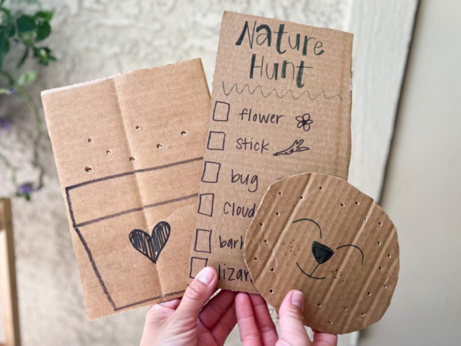 hands holding recycled box crafts