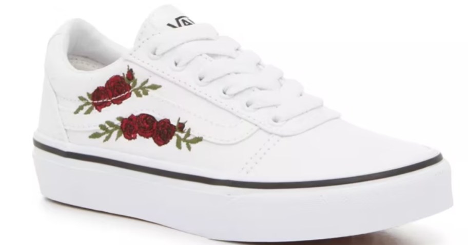 a kids Vans sneaker in white with red roses embroidered on the side