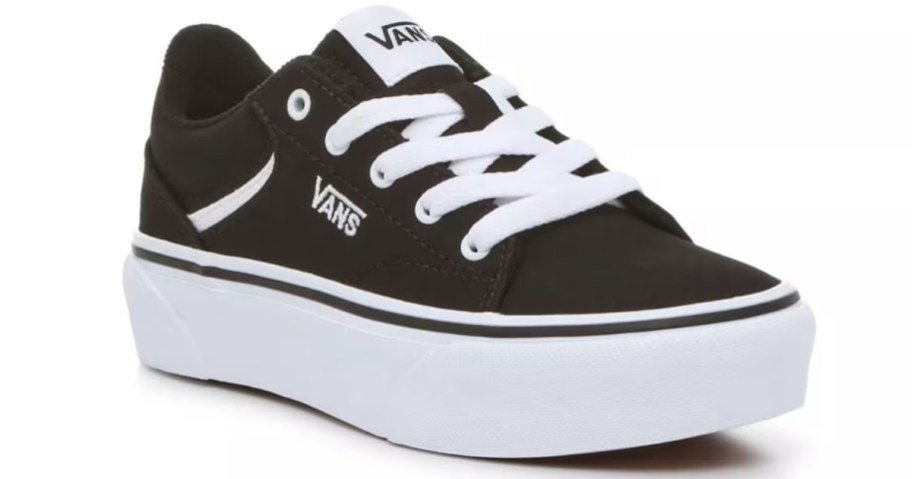 a kids Vans sneaker in black with a white platform heel