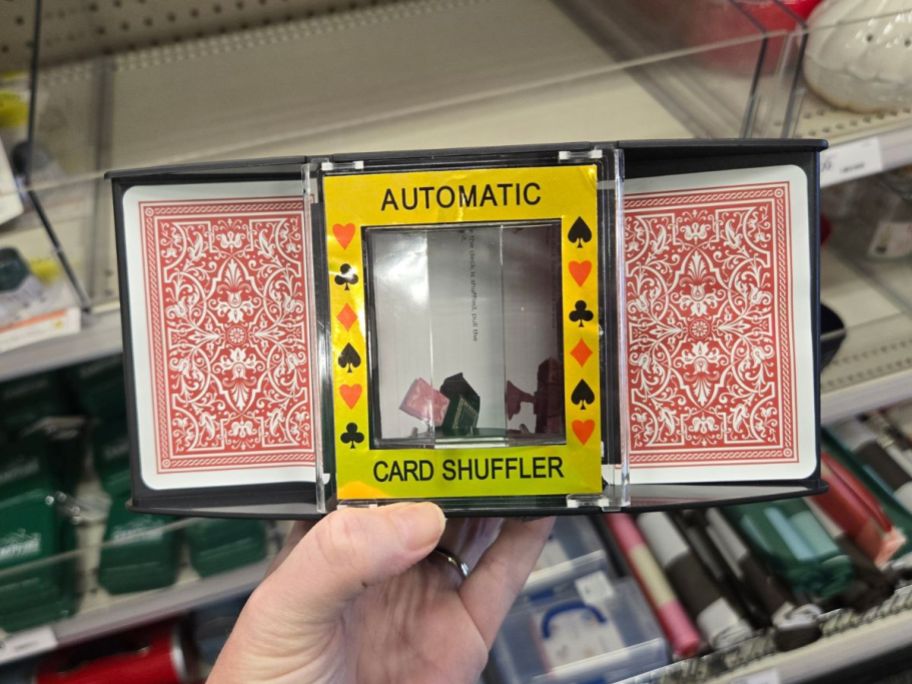 automatic card shuffler in hand in store