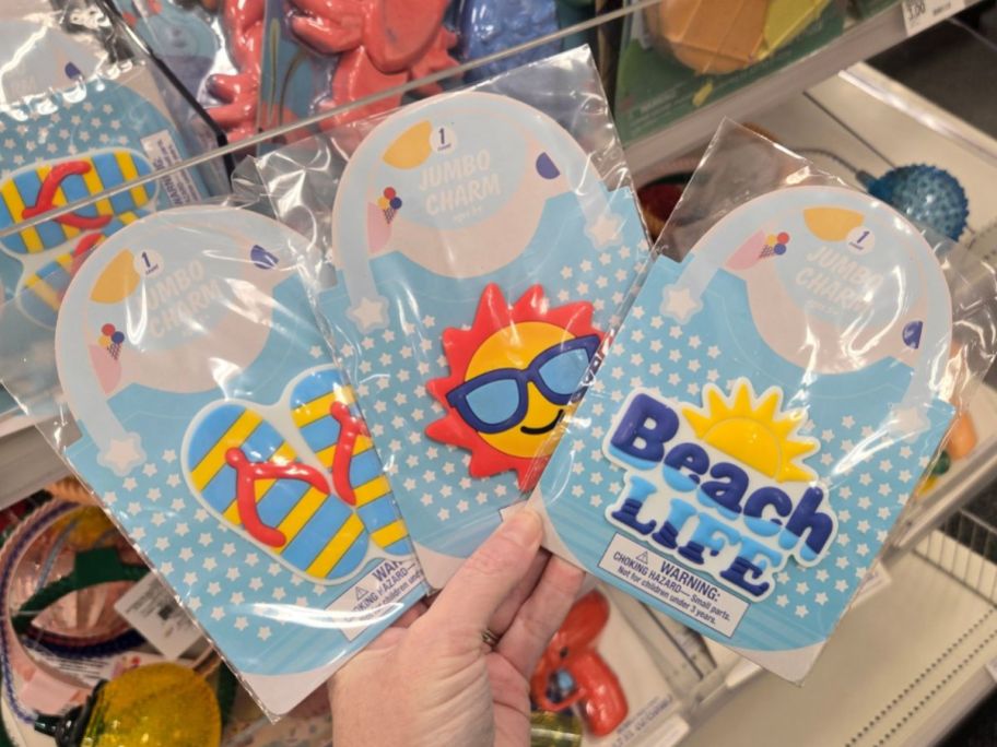 three jumbo charm packages in hand in store