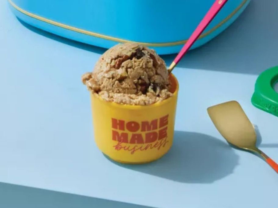 yellow and red Tabitha Brown 4-Pack Mini Ice Cream Container filled with ice cream on counter