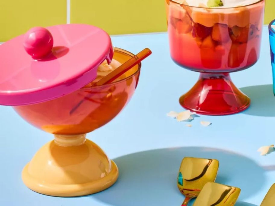 pink, red, and orange Tabitha Brown Snack & Dessert Topper Container on counter